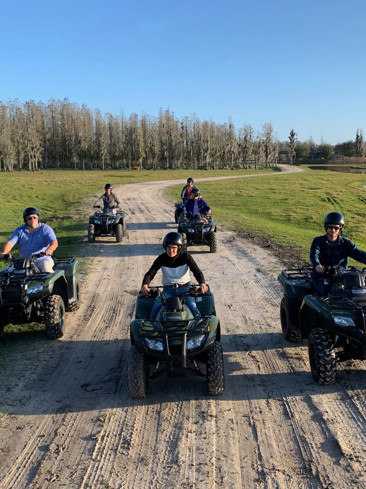 a motorcycle parked on the side of a dirt road
