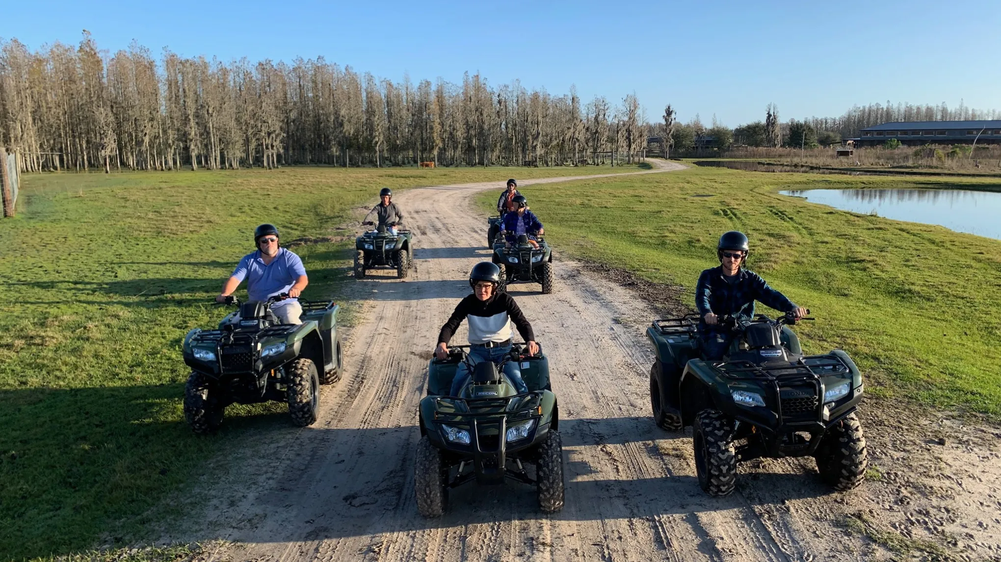 a motorcycle parked on the side of a dirt road