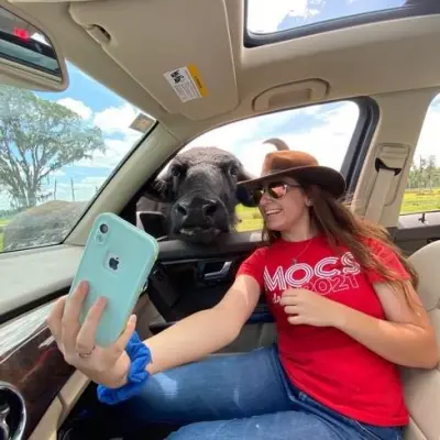 a person sitting on the seat of a car